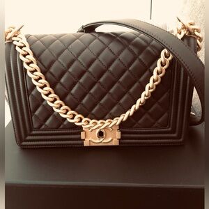 Chanel Quilted Medium Boy Flap Shoulder Bag with Gold Chain. Via